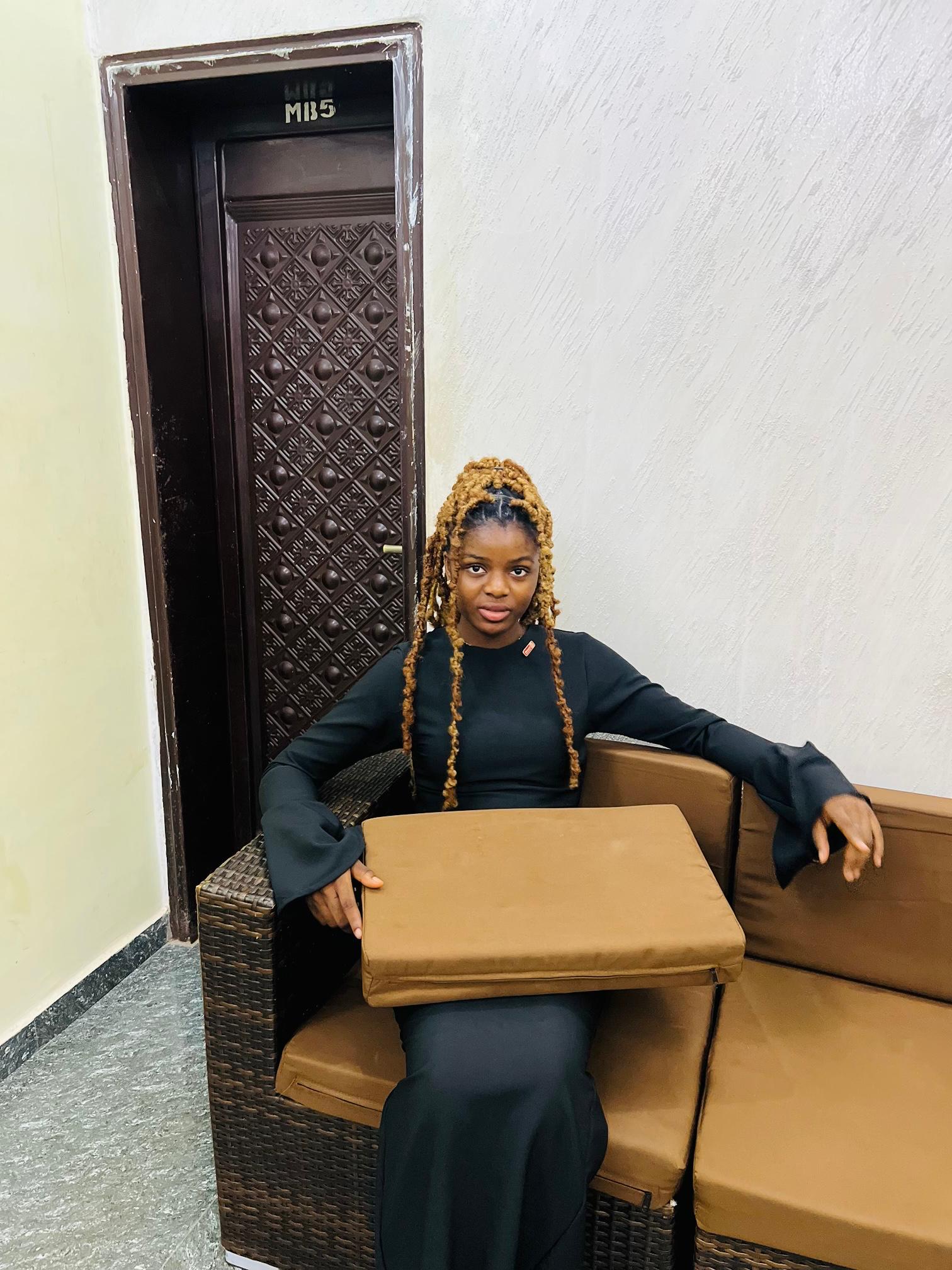 Chisom Nwodo seated and relaxed, off duty