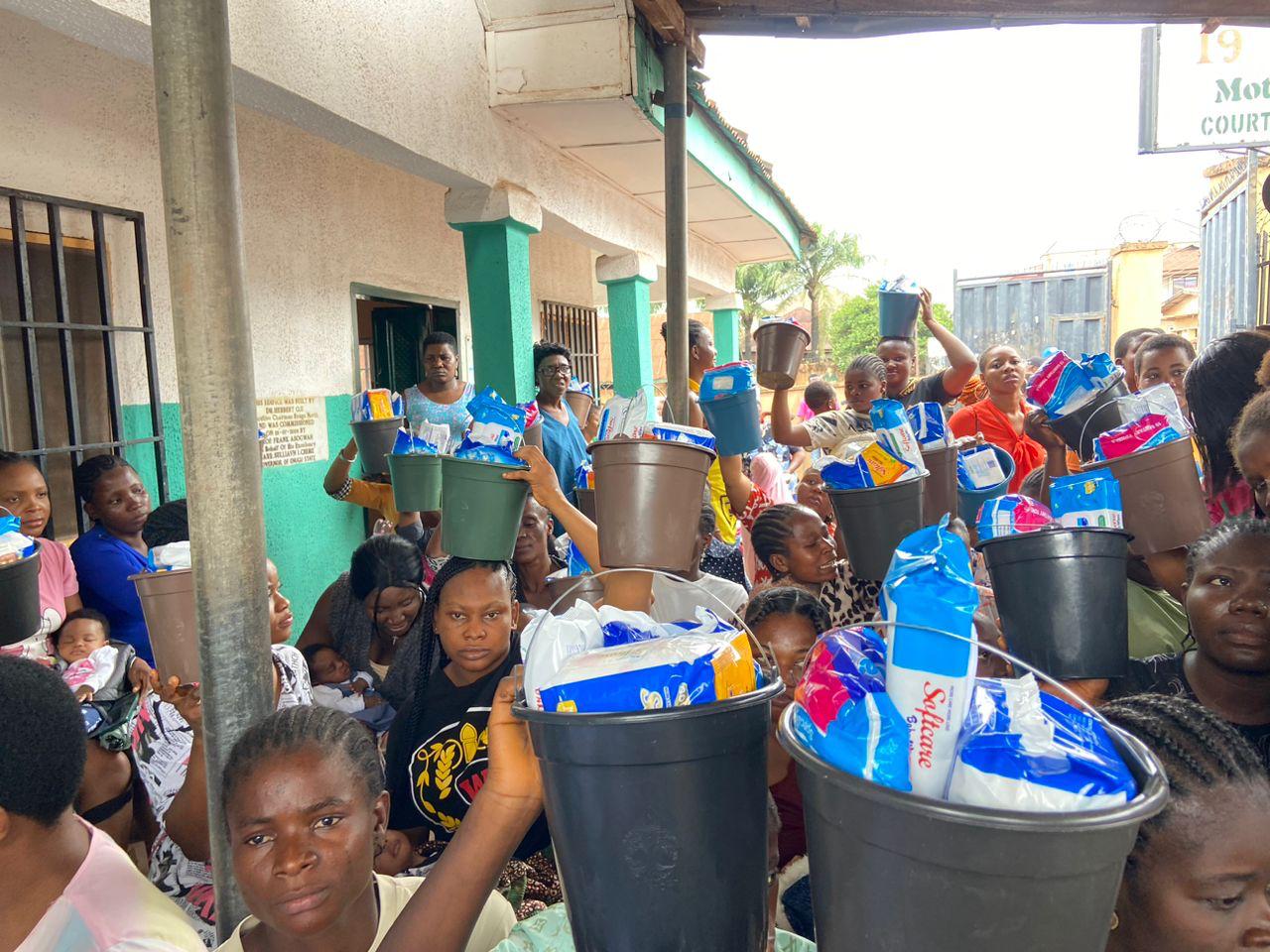 Community members receiving relief items at an outreach